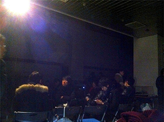 [Photo] Students in the entrance hall with an active emergency lamp, around 23:00 on March 11th 2011.